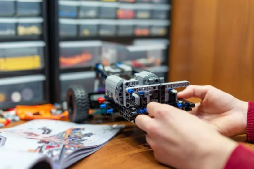 Child playing with STEM coding and Programming kits.