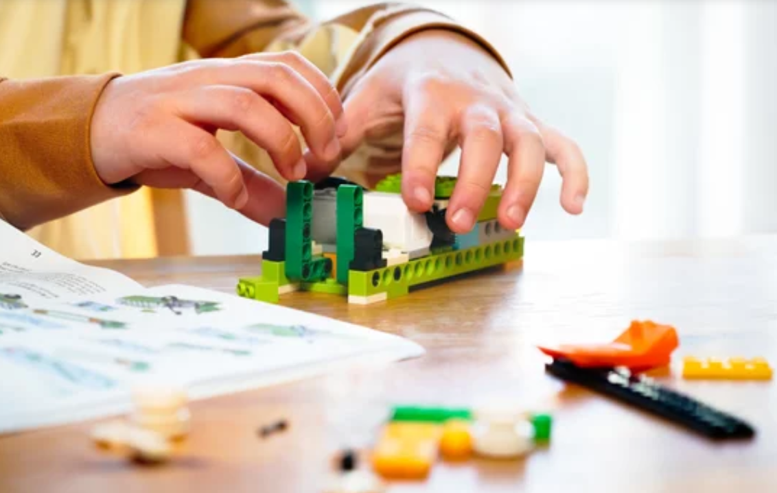 Child playing with STEM Toys Robotics Kits