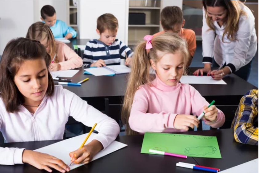 9 years old kids playing at school with stem tools